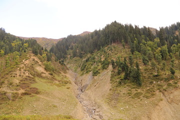View of big mountains under cloudy sky in kashmir