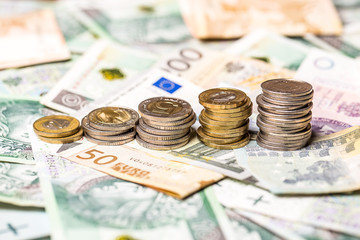 Polish and EURO currency banknotes and coins as a background