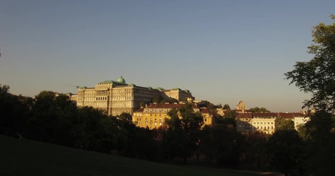 Wide shot of the south side of the historical Buda Castle from the slope of the Geller Hill in Budapest in the autumn sunset.