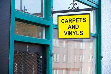 Carpets and vinyl plastic flooring for the house shop sign uk