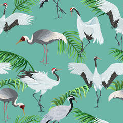 Seamless pattern with cranes and palm leaves