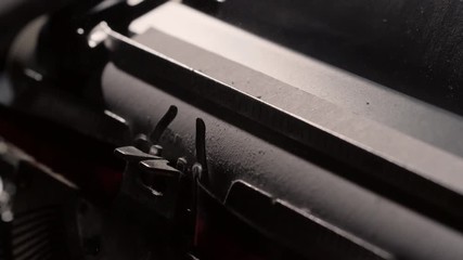 Fortune favors the bold, slow motion close up of dusty typewriter