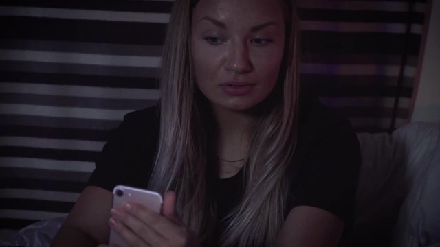 Pretty girl taking a selfie with her iPhone from different angles.
