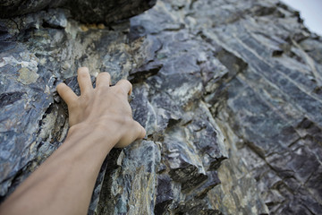 Close-up image of rock climber hand