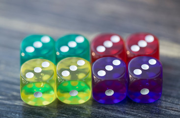 colorful dice isolated on wooden table