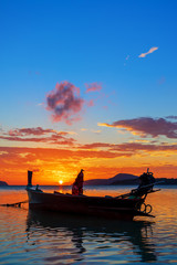 Rawai beach with andaman long tailed boat southern of thailand on clear sea water with sun shine in phuket