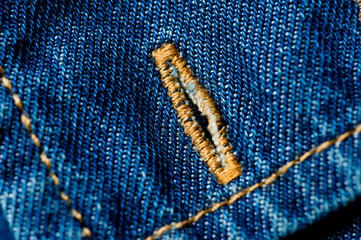 Textured blue denim texture stitched with a button-up texture