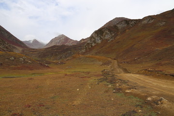 The Beautiful Tracks on big mountains in kashmir under cloudy sky