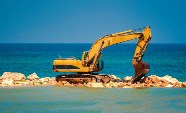 construction equipment on the shore, the construction of breakwaters, coastal protection measures