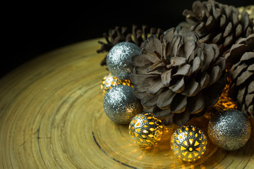 christmas ball and Pine cones  on wood  background.