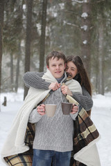 pair of lovers on a date winter afternoon in a snow blizzard