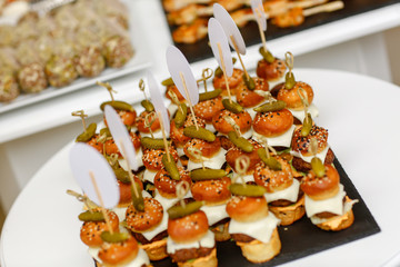table with delicious mini burgers
