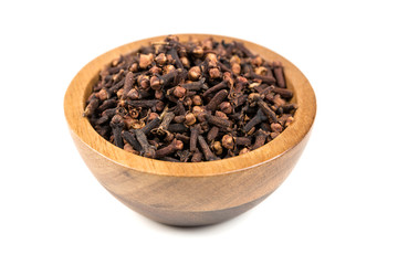 Whole clove heads and pieces isolated over white