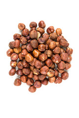 Pile of whole unshelled hazelnuts isolated