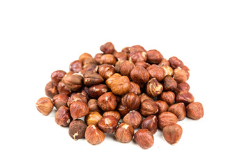 Pile of whole unshelled hazelnuts isolated