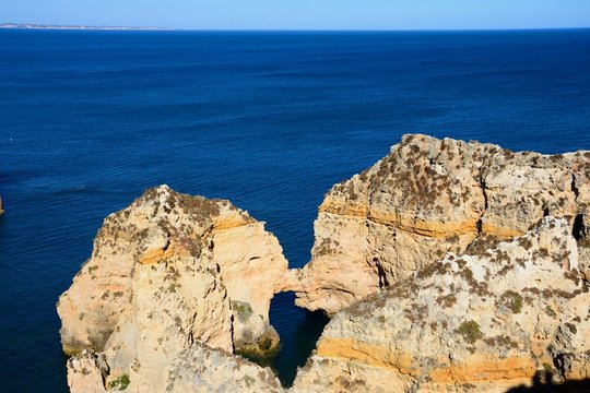 Elevated view of the cliffs with the ocean to the rear, Ponta da Piedade, Lagos, Portugal.