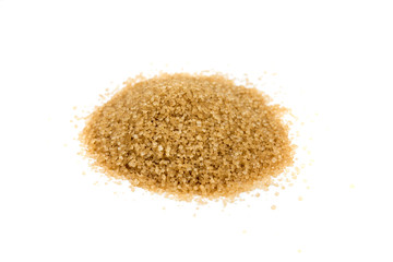 Scoop of raw cane sugar isolated over white