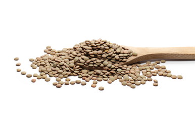 Pile of green lentils with wooden spoon isolated on white background