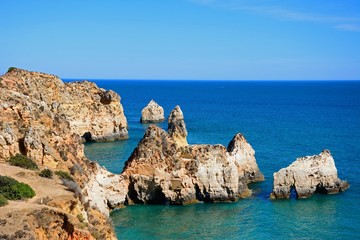 Fototapeta premium Elevated view of the cliffs with views across the ocean, Praia da Rocha, Portimao, Portugal.