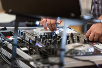 Deejay uses controls at event to entertain and amuse