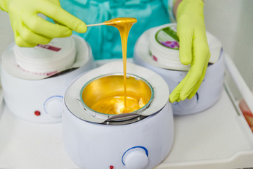 preparation for sugaring. heat up. stick. cosmetology center