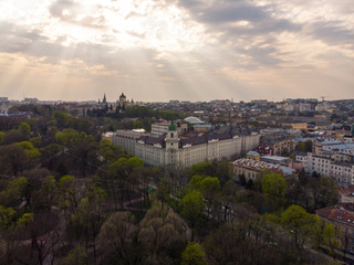 Fototapeta premium sunset view over old european town. sunset rays