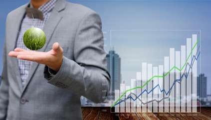 Businessman show growth chart of wind farm project