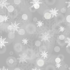 Christmas seamless snowflakes background with light boke