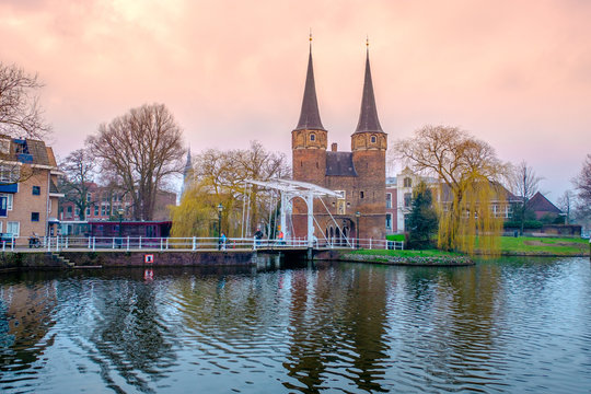 Evening view of the canal and the VVE Oostpoort de Delft. Dutch city in the spring after sunset. Holland, Netherlands.