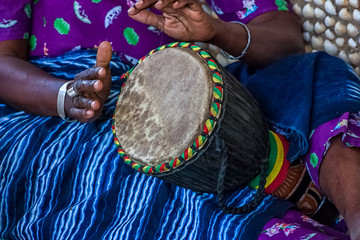 woman playing djembe