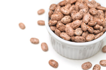 Pinto bean in a bowl on white background - isolated