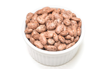 Pinto bean in a bowl on white background - isolated