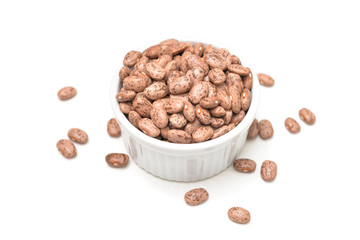 Pinto bean in a bowl on white background - isolated