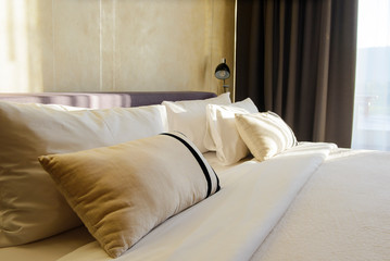Pillows and bed sheets in luxury room