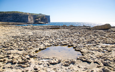 Fungus and Gebla Rock cliffs near Azure window, Gozo island, Malta