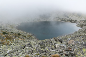 Amazing Landscape with fog over Musalenski lakes,  Rila mountain, Bulgaria