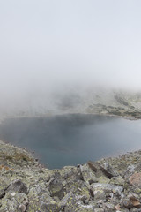 Amazing Landscape with fog over Musalenski lakes,  Rila mountain, Bulgaria