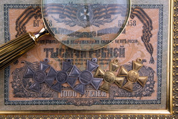 Old moneys and coins through a magnifying glass. Ordens and medals.Numismatics and collecting money.Russian Empire