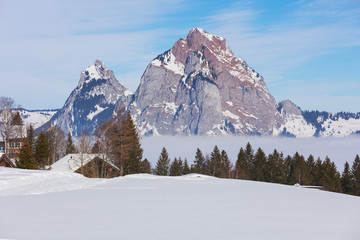 Fototapeta na wymiar View from the village of Stoos in the Swiss canton of Schwyz in winter, Kleiner Mythen and Grosser Mythen summits in the background