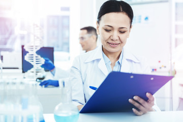 Nice smart woman working in the biological laboratory