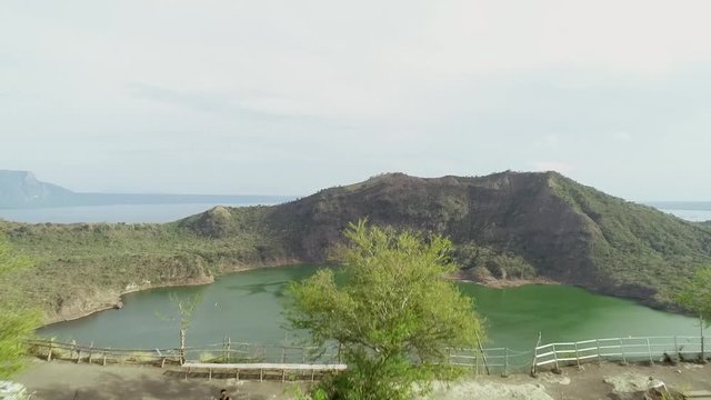 Aerial view of observation point of tall volcanic lake in Talisay, Philippines.