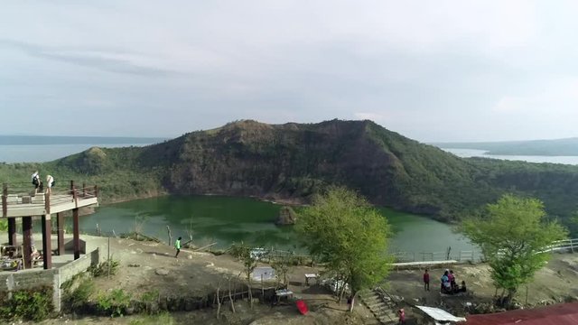Aerial view of observation point of tall volcanic lake in Talisay, Philippines.