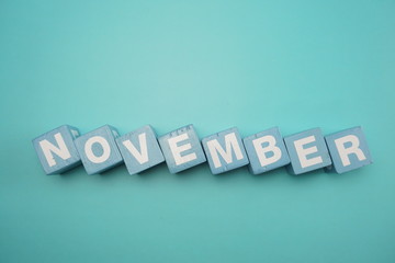 November alphabet letters on blue background