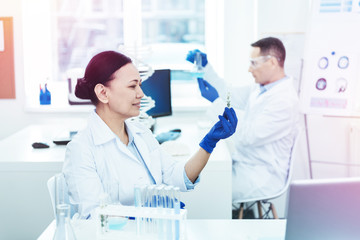 Smart female researcher working in the lab