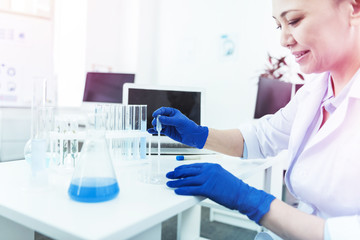 Positive intelligent woman taking a test sample