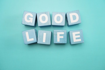 Good Life created with cubes alphabet letters on blue background