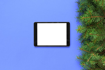 blank screen tablet on purple background, christmas time top view