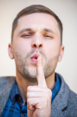 Man blowing on index finger imaginary gun