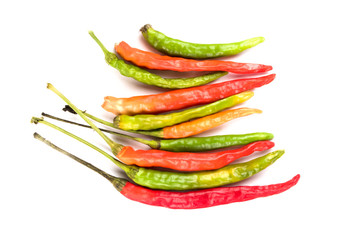 Close-up of colorful hot peppers. Group of red green and yellow peppers on white background