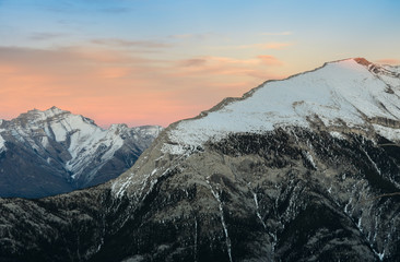 Beautiful snow capped mountains against the twilight sky at Banff National Park in Alberta, Canada.
